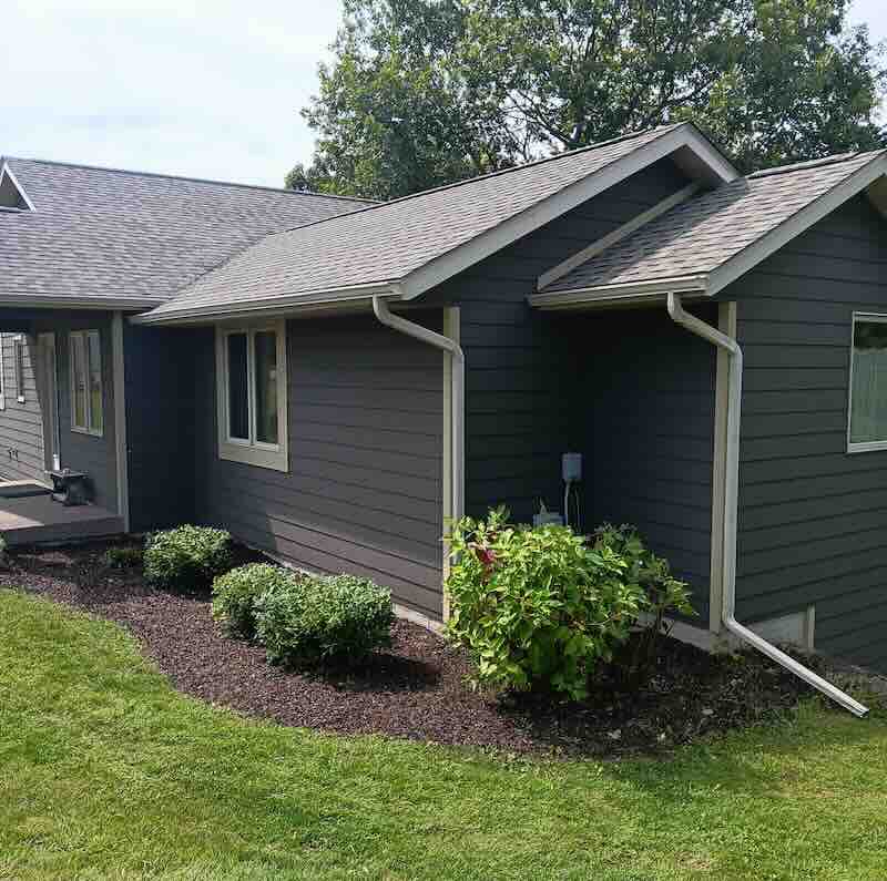 Modern gray house with well-kept garden