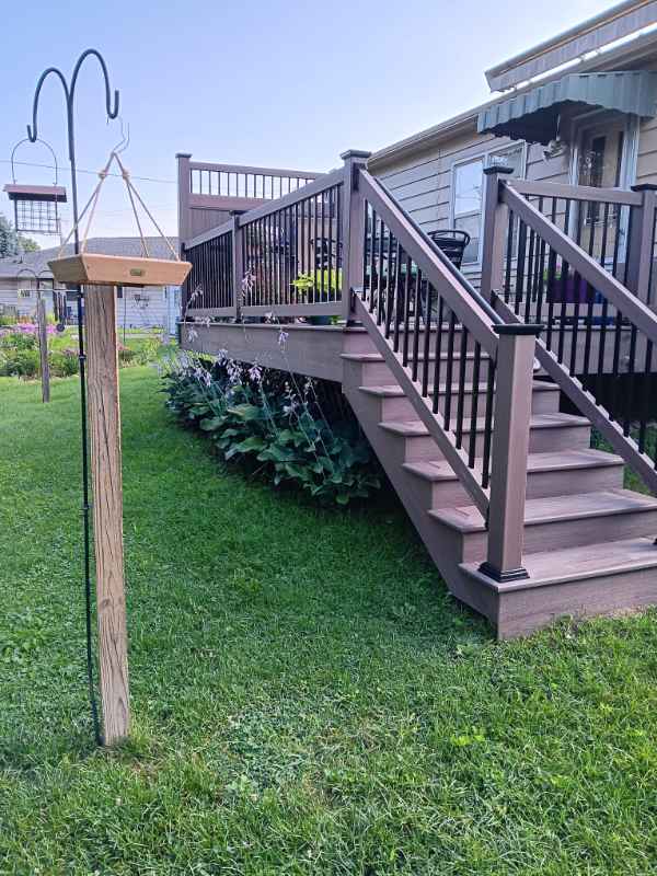 Backyard deck with stairs and bird feeders